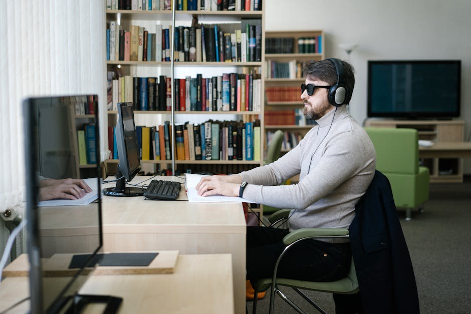 Person doing eye exercises at computer desk with good lighting