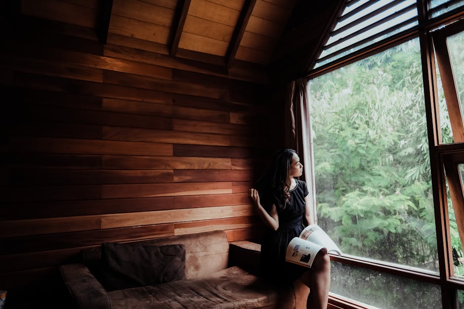 Person reading book in good natural lighting by window